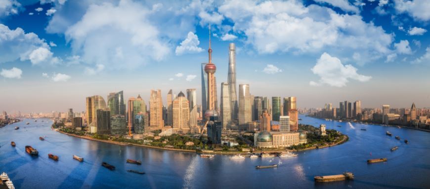 Shanghai skyline with the Huangpu River and skyscrapers like the Oriental Pearl Tower and Shanghai Tower